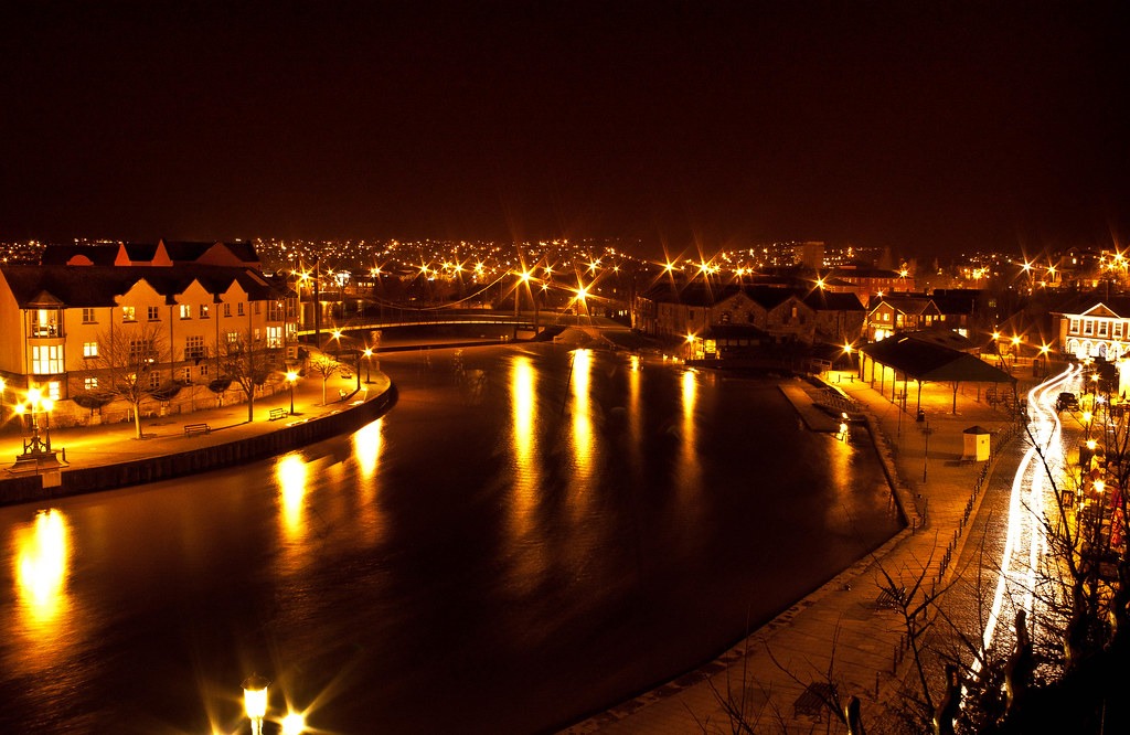 Night view from Brisk Agency's Exeter office balcony on Exeter Quay, showcasing the scenic river and city lights.