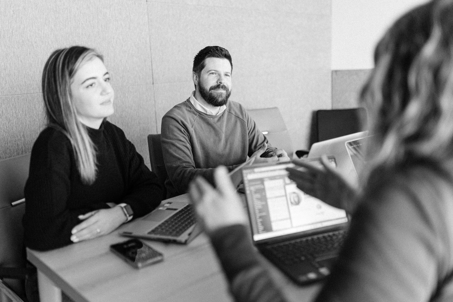 Team members in a meeting at Brisk Agency, a leading website design and marketing agency in Exeter and London.