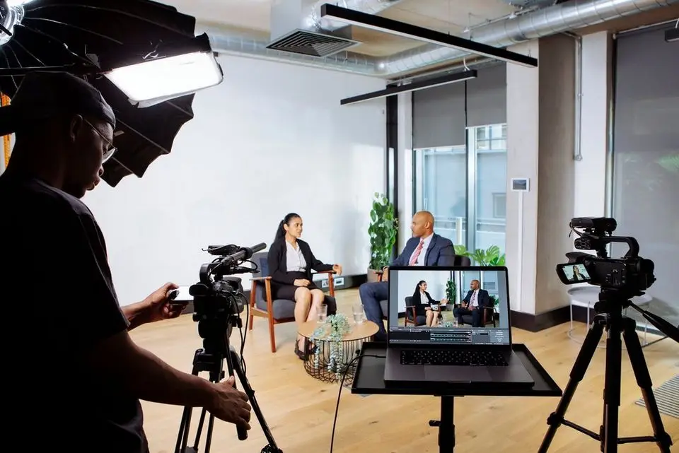 Professional video production setup for a corporate interview, showcasing Brisk Agency's expertise as a branding, video production, and video editing agency in London and Exeter.