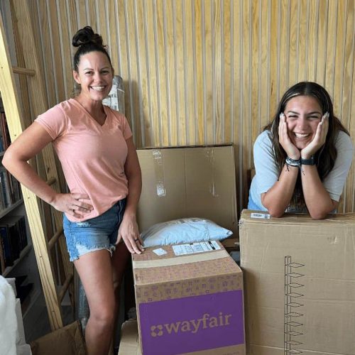 Two women posing with Wayfair boxes, showcasing Brisk Agency's work with clients as an Influencer Marketing Agency based in London and Exeter.